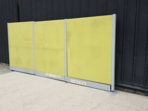 Office partition with power outlet, light green.