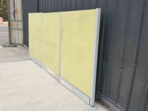 Office partition with power outlet, light green.