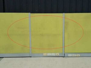 Office partition with power outlet, light green.