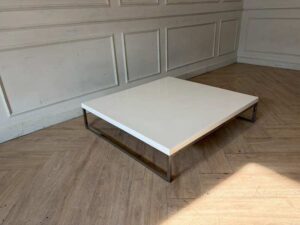 Coffee table with white synthetic stone top and stainless steel legs. (1)