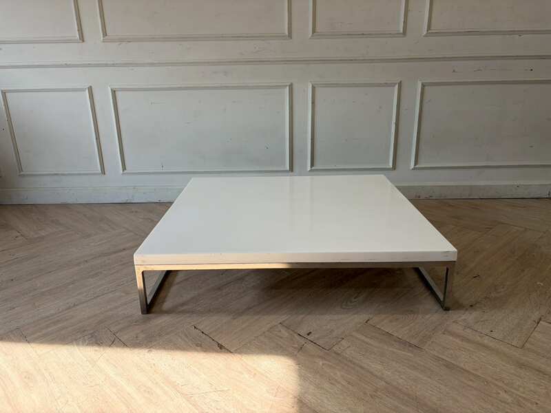 Coffee table with white synthetic stone top and stainless steel legs. (1)