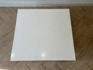 Coffee table with white synthetic stone top and stainless steel legs. (1)