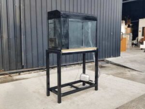 Fish tank with black steel legs