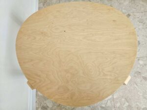 Set of two stacking wooden tables, triangular shape, curved legs, IKEA brand.