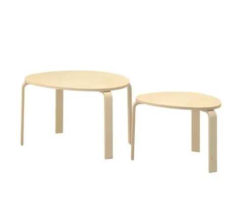 Set of two stacking wooden tables, triangular shape, curved legs, IKEA brand.