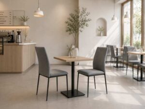 Chair with metal legs and light gray fabric seat.