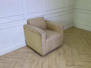 Cream-colored fabric armchair._RWY1JBR5BL