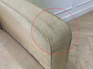 Cream-colored fabric armchair._RWY1JBR5BL