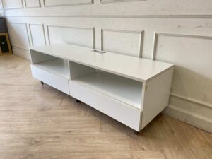 Wooden TV stand with 2 drawers and 2 storage compartments, includes power strip, white color.