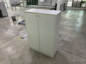 Tall shoe cabinet with two doors.