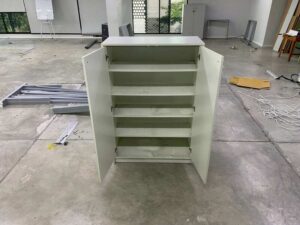 Tall shoe cabinet with two doors.