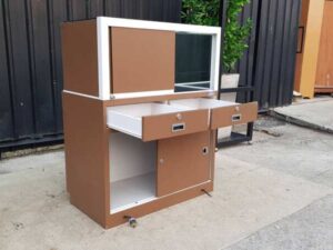 Jewelry display cabinet with glass, 1 opening door, 1 sliding door, 2 drawers, brown.