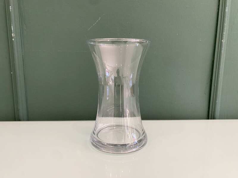 Tall, clear glass flower vase.