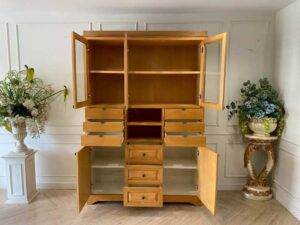 Teak wood cabinet with 5 doors, 9 drawers, and 2 shelves.
