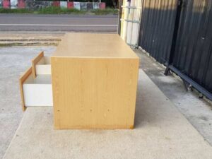 Two-drawer desk, brown wooden frame, 150 cm wide.