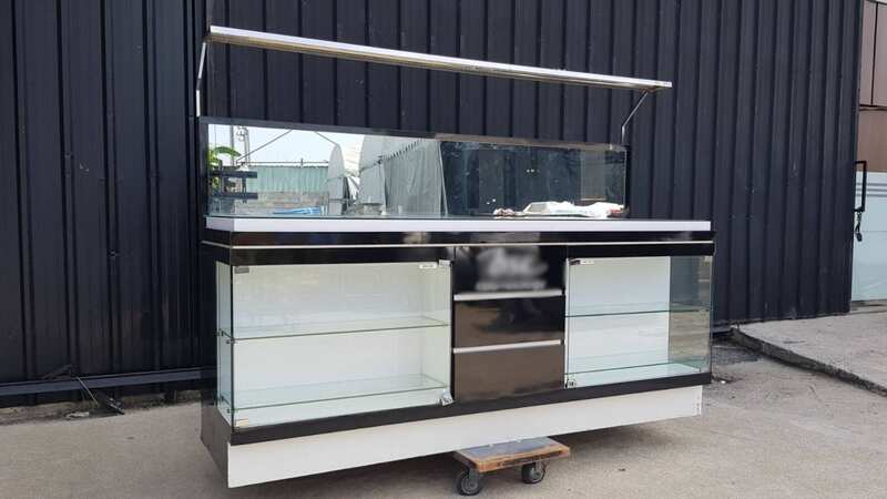 Black display cabinet with two glass doors and five wooden doors.