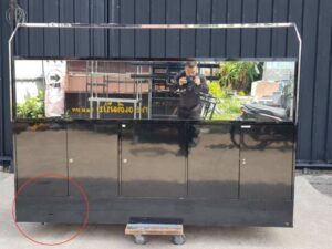 Black display cabinet with two glass doors and five wooden doors.