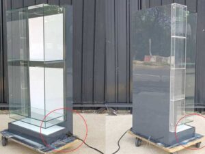 Two-shelf glass display case, black.