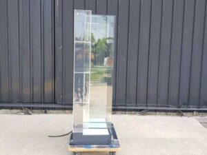 Two-shelf glass display case, black.