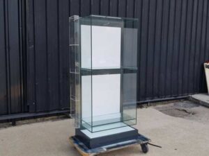 Two-shelf glass display case, black.