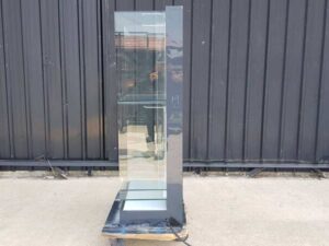 Two-shelf glass display case, black.