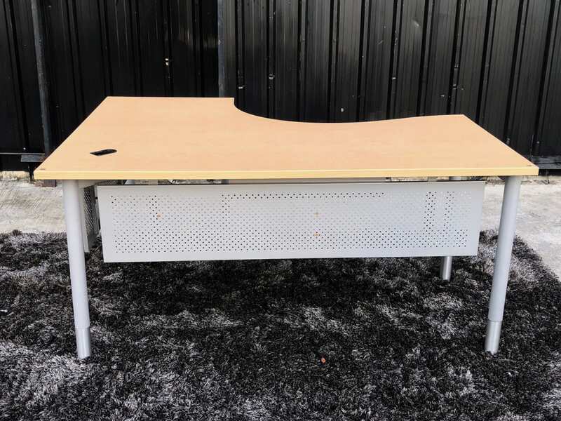 L-shaped work desk, gray steel frame, wooden top.
