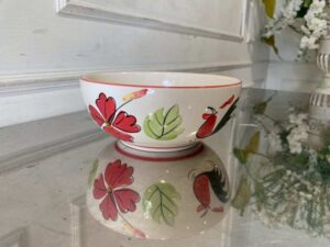 8-inch ceramic bowl with rooster logo, red rim.