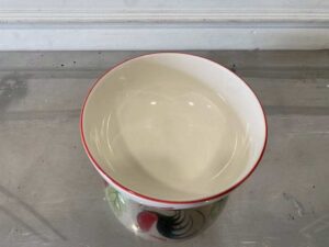 8-inch ceramic bowl with rooster logo, red rim.