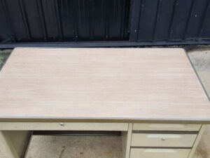 TAIYO brand cream-colored steel desk with 3 drawers and a wood top.