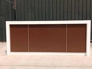 White and brown wooden counter with 3 drawers.