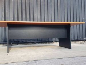 8-seat conference table with brown wood top