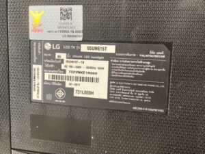 65-inch wall-mounted TV, LG brand, model 65UH615T