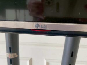 65-inch wall-mounted TV, LG brand, model 65UH615T