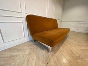 Two-seater sofa bed upholstered in orange fabric, 187 cm.