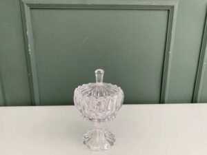 Crystal glass bowl with grooved lid and base.