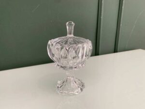 Crystal glass bowl with grooved lid and base.