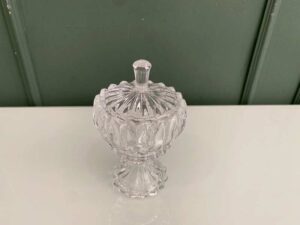 Crystal glass bowl with grooved lid and base.