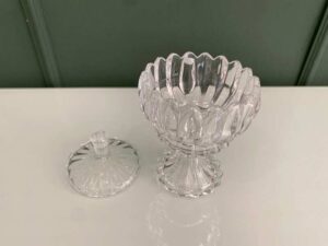 Crystal glass bowl with grooved lid and base.