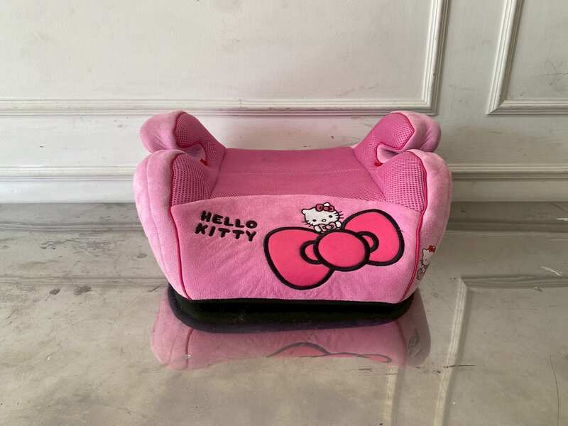 Child car booster seat with Kitty embroidery, pink color.