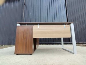 Brown L-shaped desk with attached cabinet