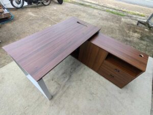 Brown L-shaped desk with attached cabinet