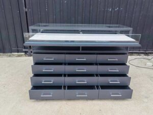 Glass display case, jewelry cabinet with 12 drawers.