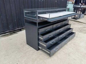 Glass display case, jewelry cabinet with 12 drawers.