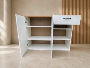 2-door, 1-drawer cabinet; white body with wood-grain top.
