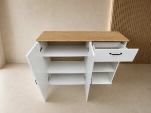 2-door, 1-drawer cabinet; white body with wood-grain top.