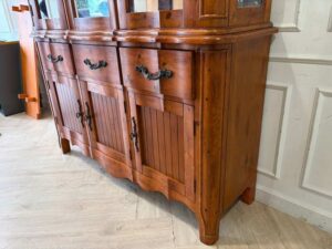Wooden display cabinet with three glass doors, three drawers, and three small compartments; features two separable sections and internal lighting (1)