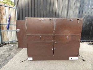 Brown glass display cabinet featuring 2 hinged-door compartments, 2 drawers, and 1 storage compartment (no keys; all sections are accessible).