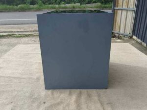 Display cabinet with glass panels on the top and all four sides (front and back).