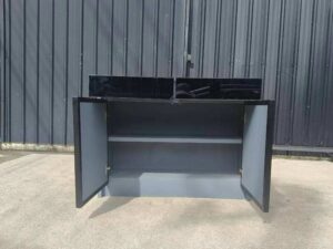 Display cabinet with glass panels on the top and all four sides (front and back).
