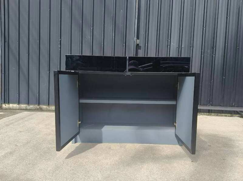 Display cabinet with glass panels on the top and all four sides (front and back).